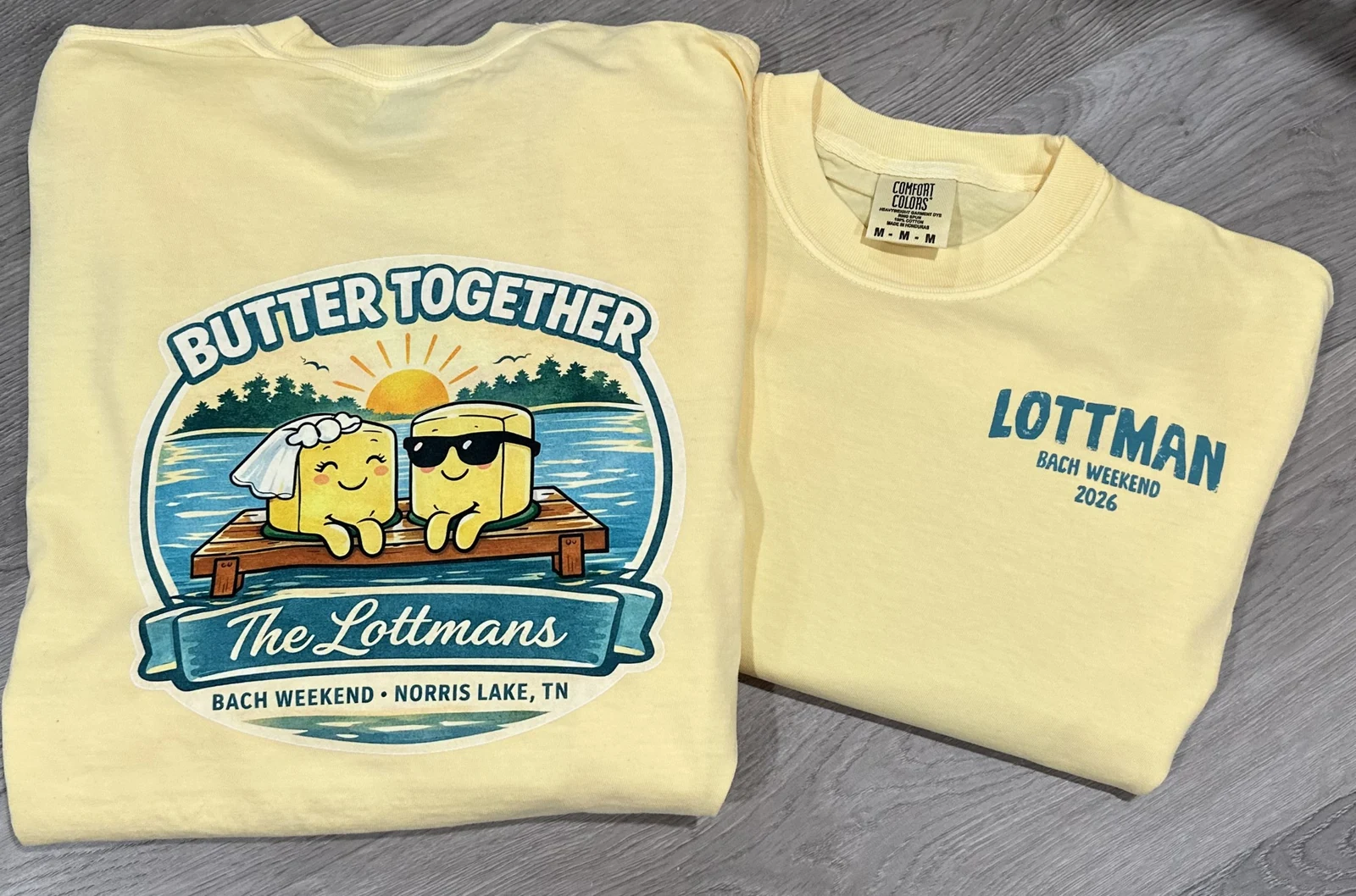 Pale-yellow shirts printed with a full-color Butter Together lake design on the back and a name on the front
