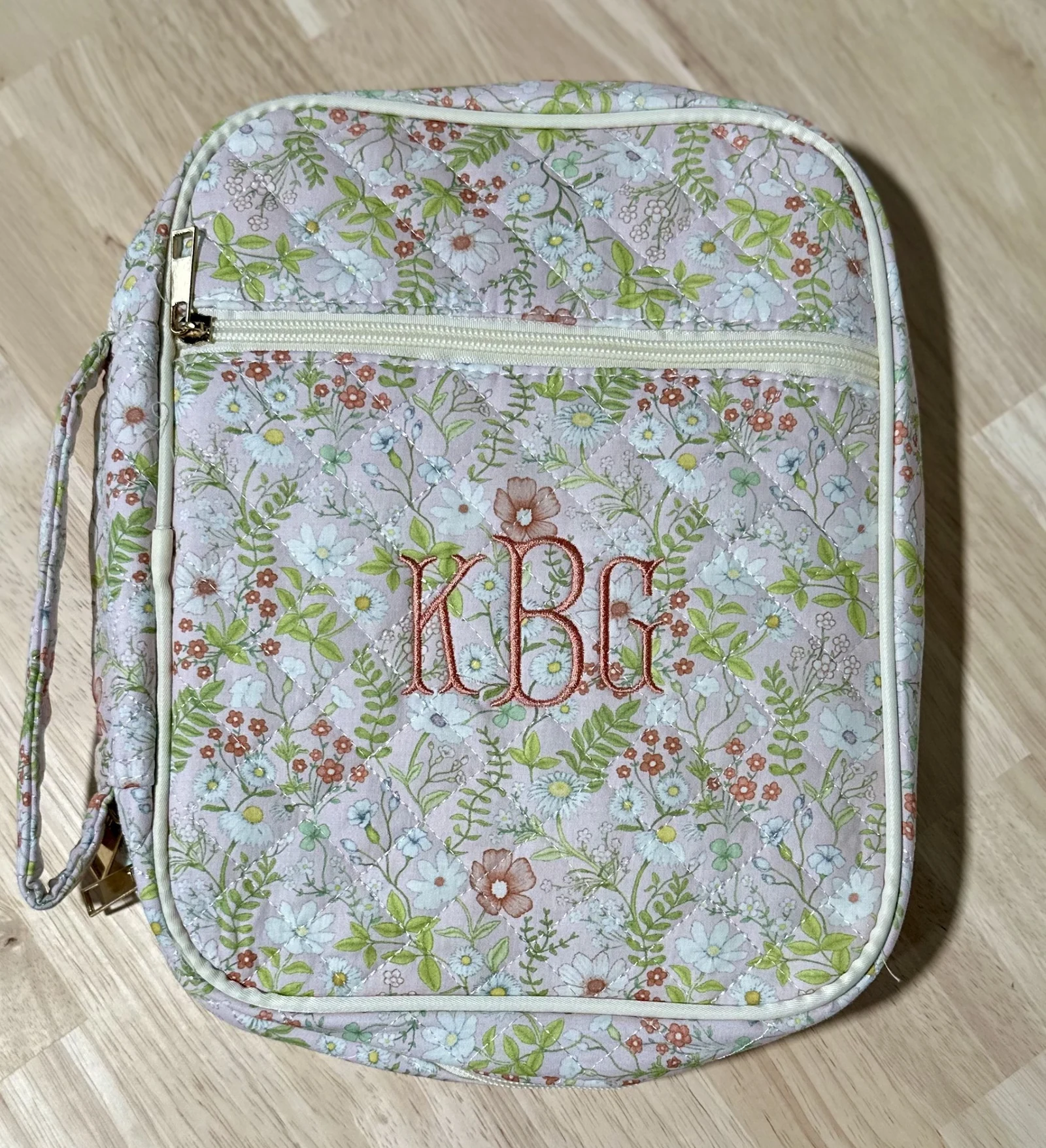 Quilted pink floral lunch bag with a coral three-letter monogram